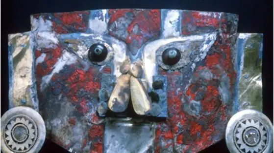 An ancient gold mask from Peru is painted with human blood
