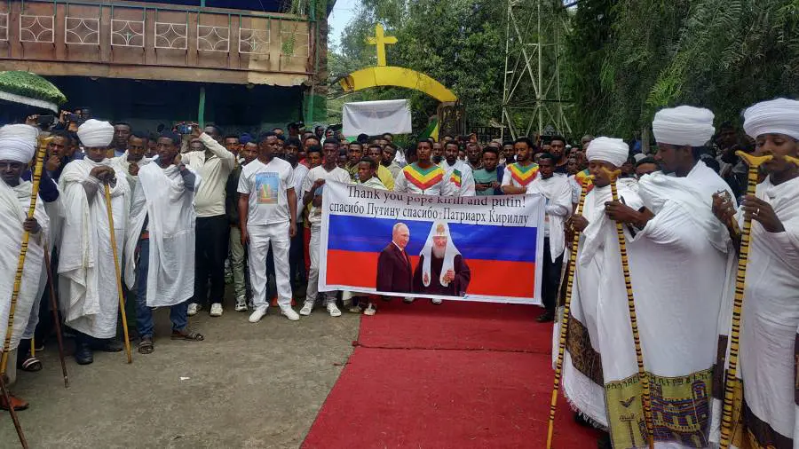 Believers in Africa with “Thank you Putin” posters