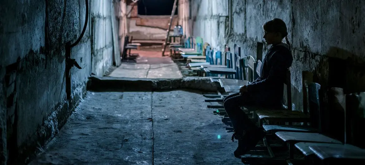 A young girl sites in a bomb shelter in the basement of her school in Donetsk Oblast, Ukraine. (file)