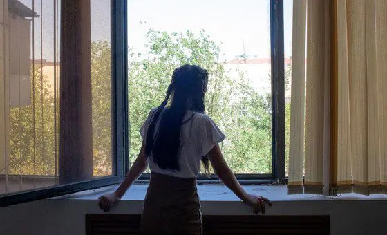 A 14-year-old girl looks out the window, in Kyzylorda, Kazakhstan. Recently, she has addressed feelings of stress and anxiety with the help of an educational psychologist. A 14-year-old girl looks out the window, in Kyzylorda, Kazakhstan. Recently, she has addressed feelings of stress and anxiety with the help of an educational psychologist.