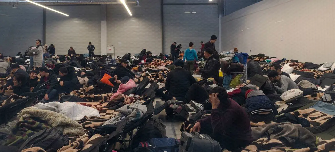Hundreds of people fleeing from Ukraine gathered in shopping malls near the border crossing in Korczowa, Poland.