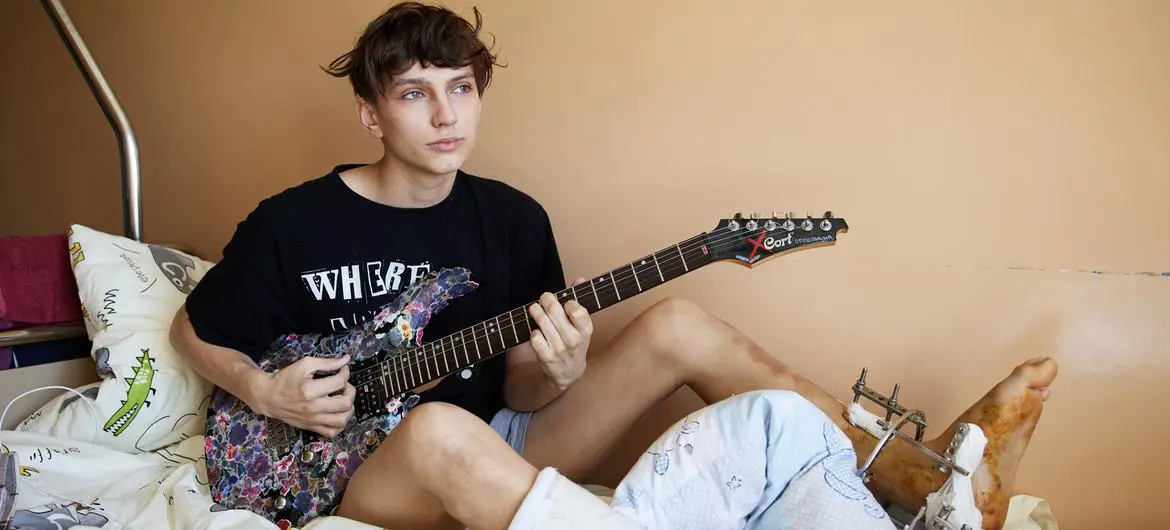 A young boy recovers at a hospital in Lviv, Ukraine, after being injured in the car he was travelling ran over a landmine.