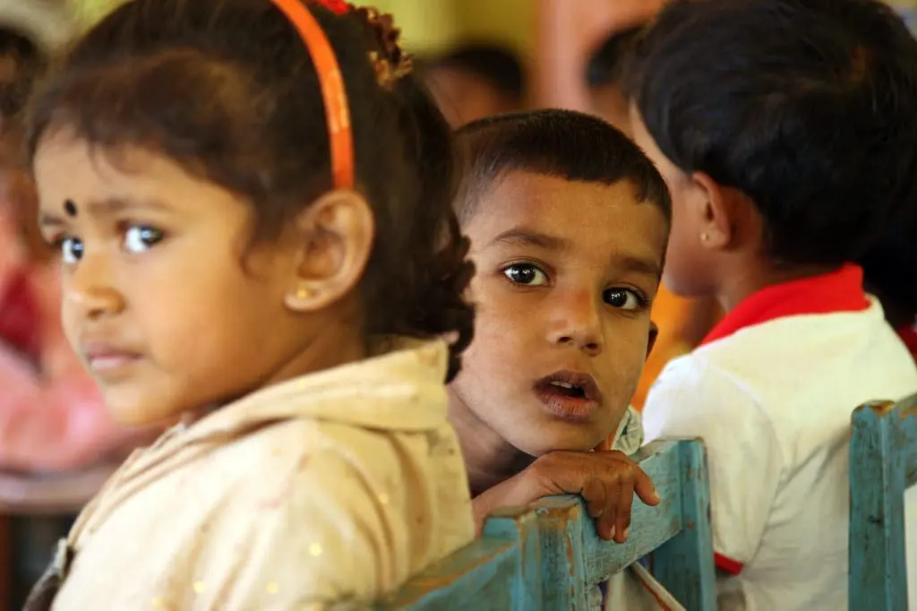 Young children wait in Sri Lanka for Mobile Health Clinic at "Ekamuthu" Pre-School.