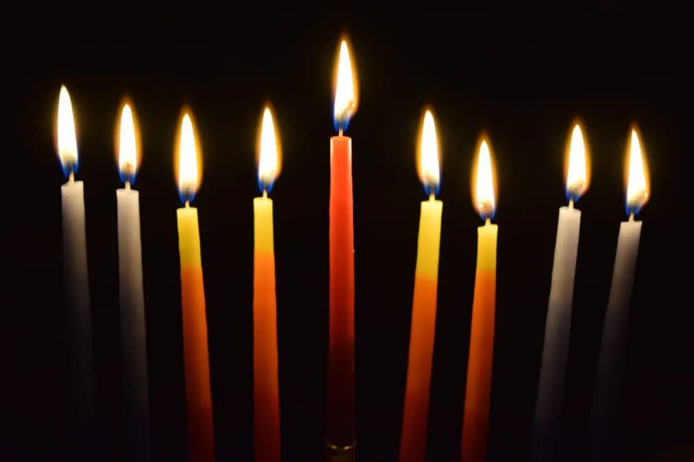 What does the church candle symbolize?