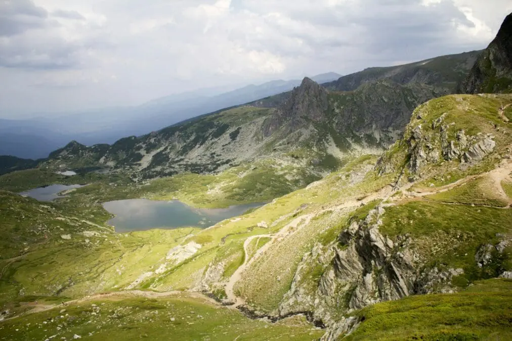 a view of a mountain with a lake in the middle of it