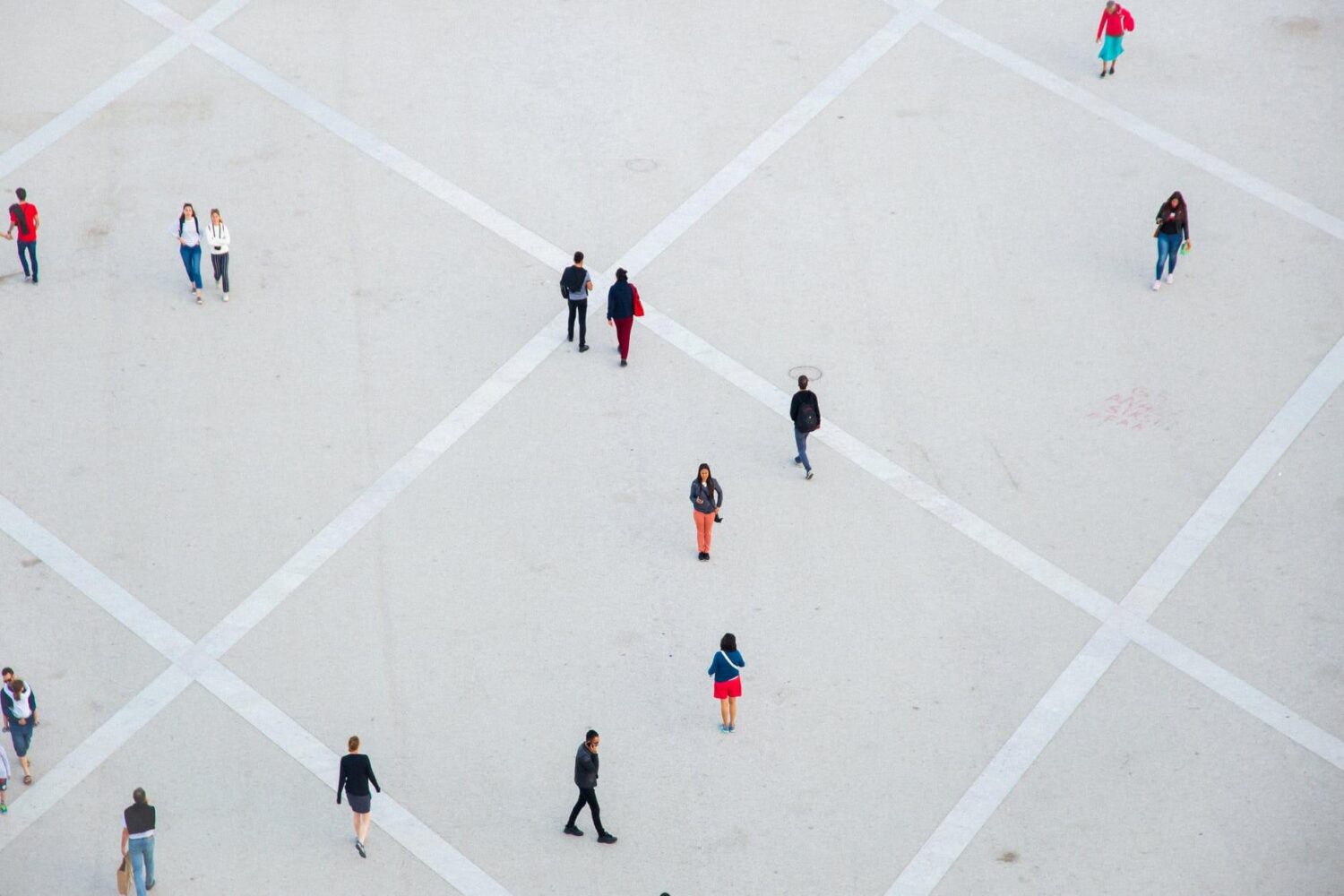 people walking on spacious concrete square