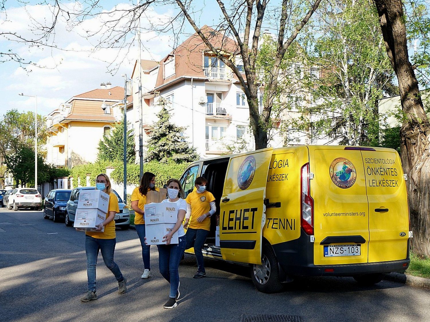 The Scientology Volunteer Ministers arrive at the Mothers to Mothers Foundation with Mother’s Day gifts and bags of food for needy moms.