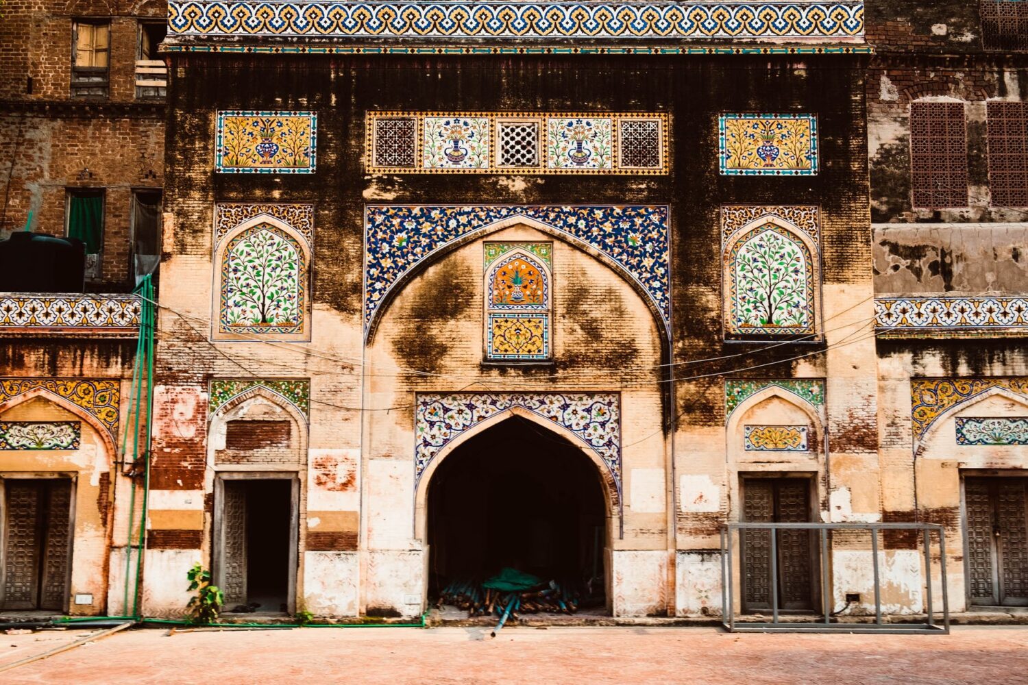 facade of an old building designed with colorful mosaic tiles