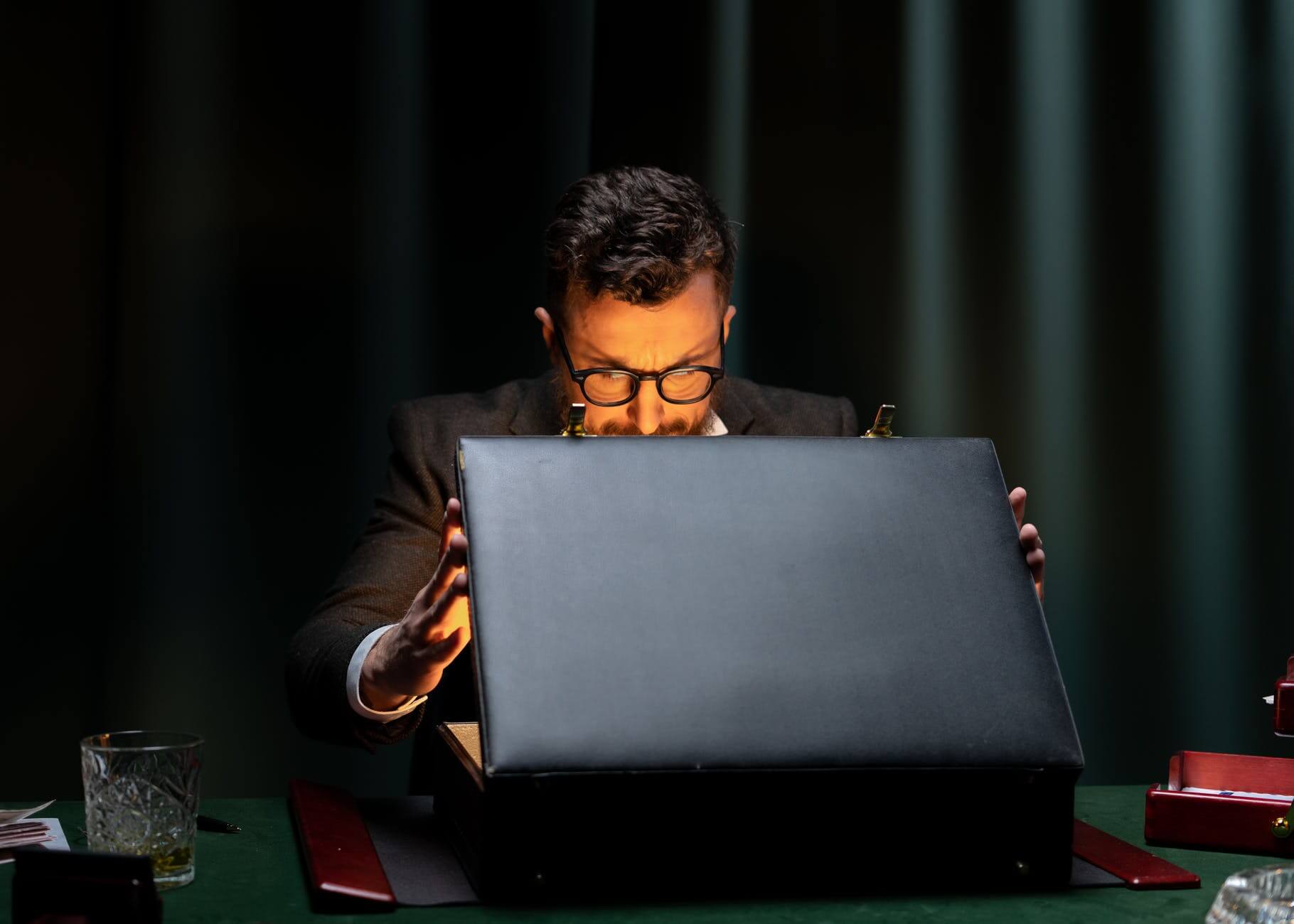 man in black long sleeve shirt using black laptop computer