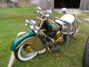1947 Indian Chief motorcycle, an older restore that’s green and gold and with all the stainless-steel parts supposedly dipped in gold (although it has not been tested).