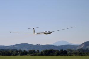A glider flying over the ground