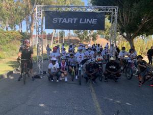 All the kids lined up under the start line banner for a photo with world-renowned champion cyclist and Los Angeles native, Rahsaan Bahati, along with Olympic silver-medalist Mari Holden and Founder of Streets Are For Everyone, Damian Kevitt. They then la