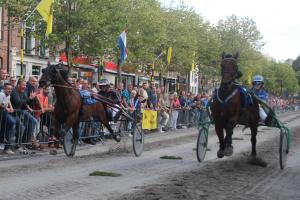 Horses competing in street race in the town of Medemblik