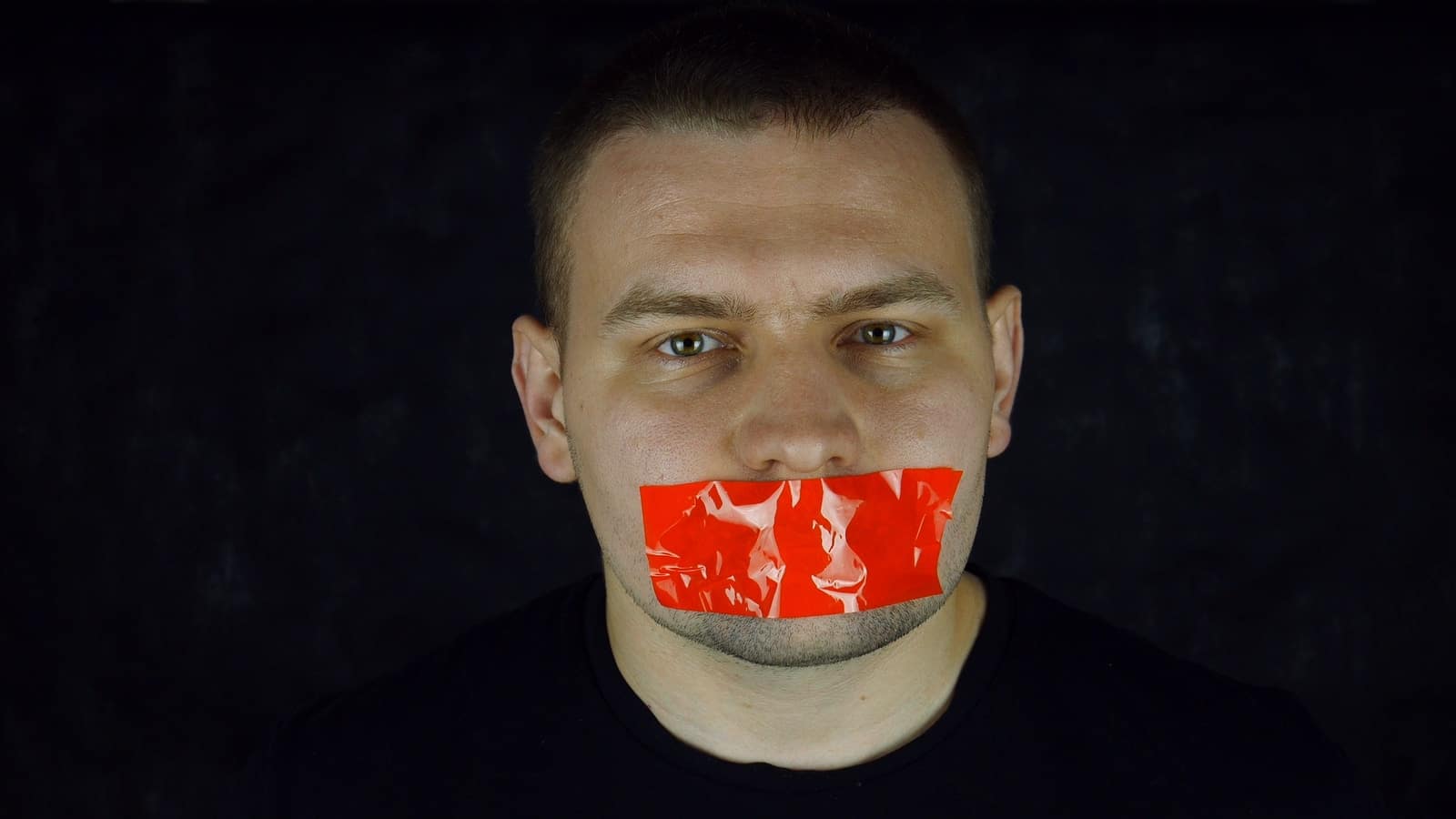 man in black crew neck shirt with red and white face paint