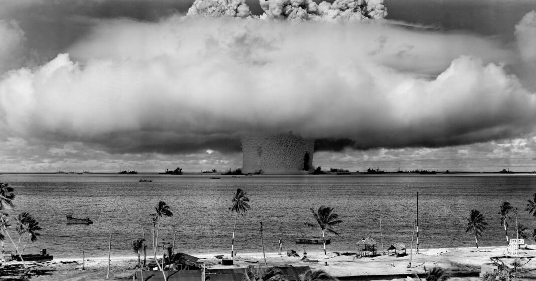 Grayscale Photo of Nuclear Explosion on the Beach