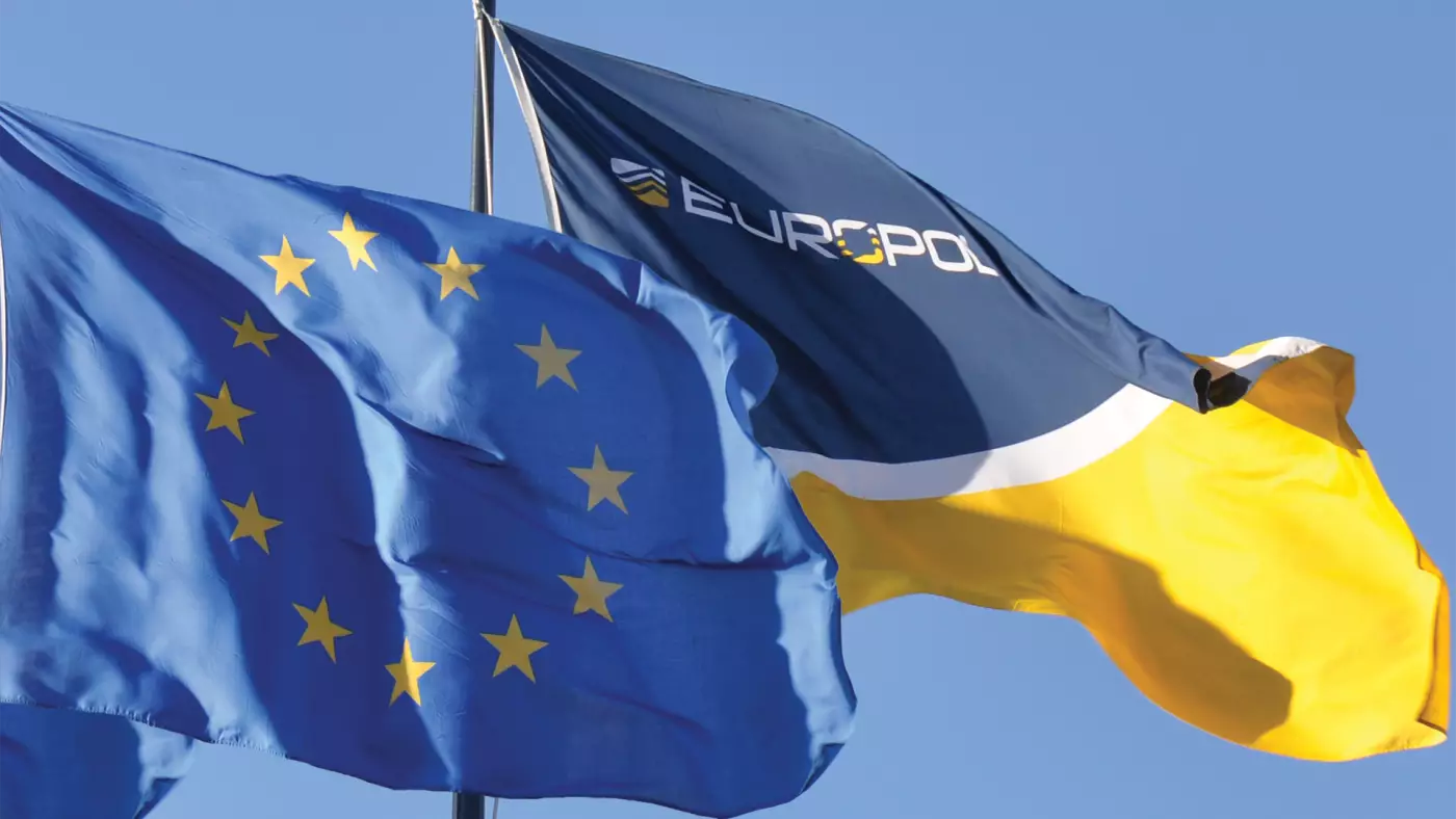 the European flag and the Europol flag fly side by side - Parliament backs giving more powers to Europol, but with supervision