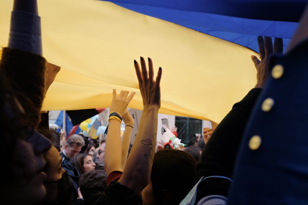 Ukraine flag over protesters