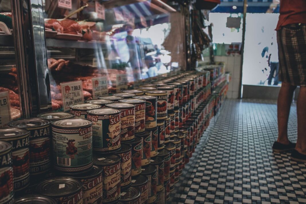 brown and white labeled cans on display counter