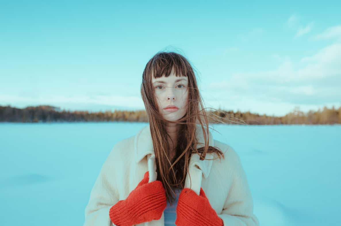 Siv Jacobsen with a lake behind