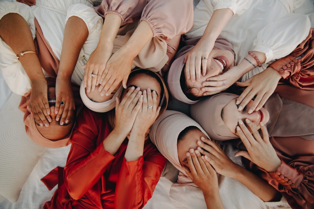 Abaya - Group of Women Lying and Covering Their Faces