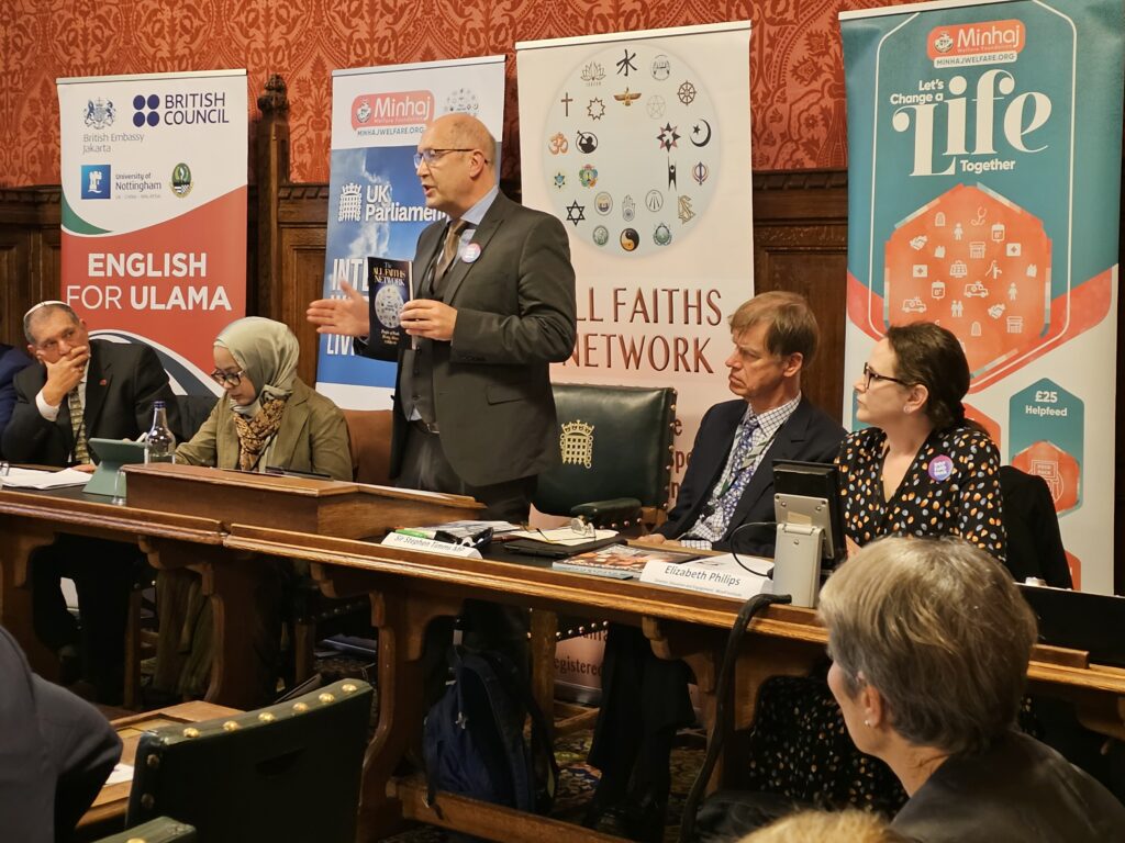 Martin Weightman, Director of All Faiths Network, at the UK Parliament, presenting the book "People of Faith: Rising Above COVID-19" published by FoRB Publications.