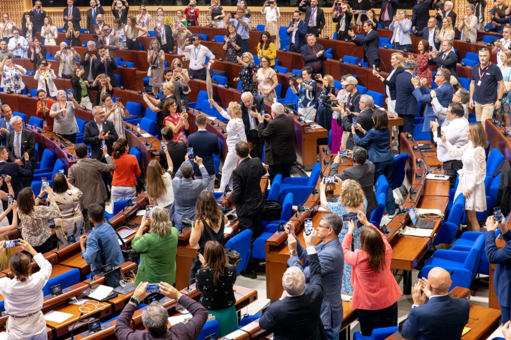 The Olympic Torch enters the Parliamentary Assembly for the firs time. Photo: