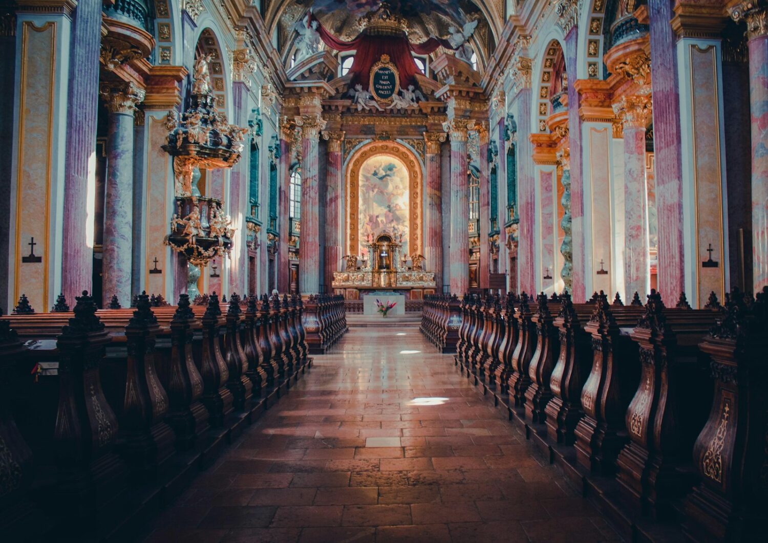 brown wooden chairs inside cathedral in Hungary